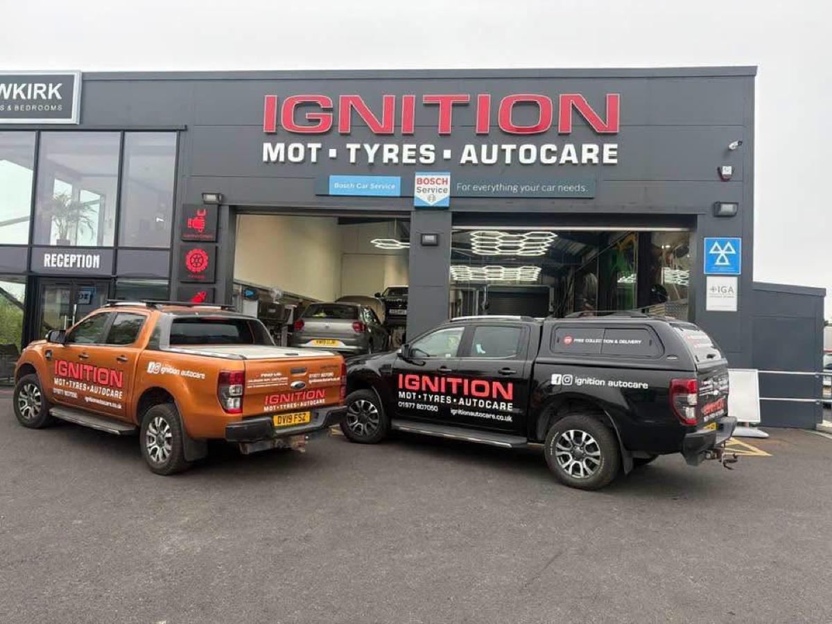 Ignition Autocare branded fleet vehicles outside Castleford garage