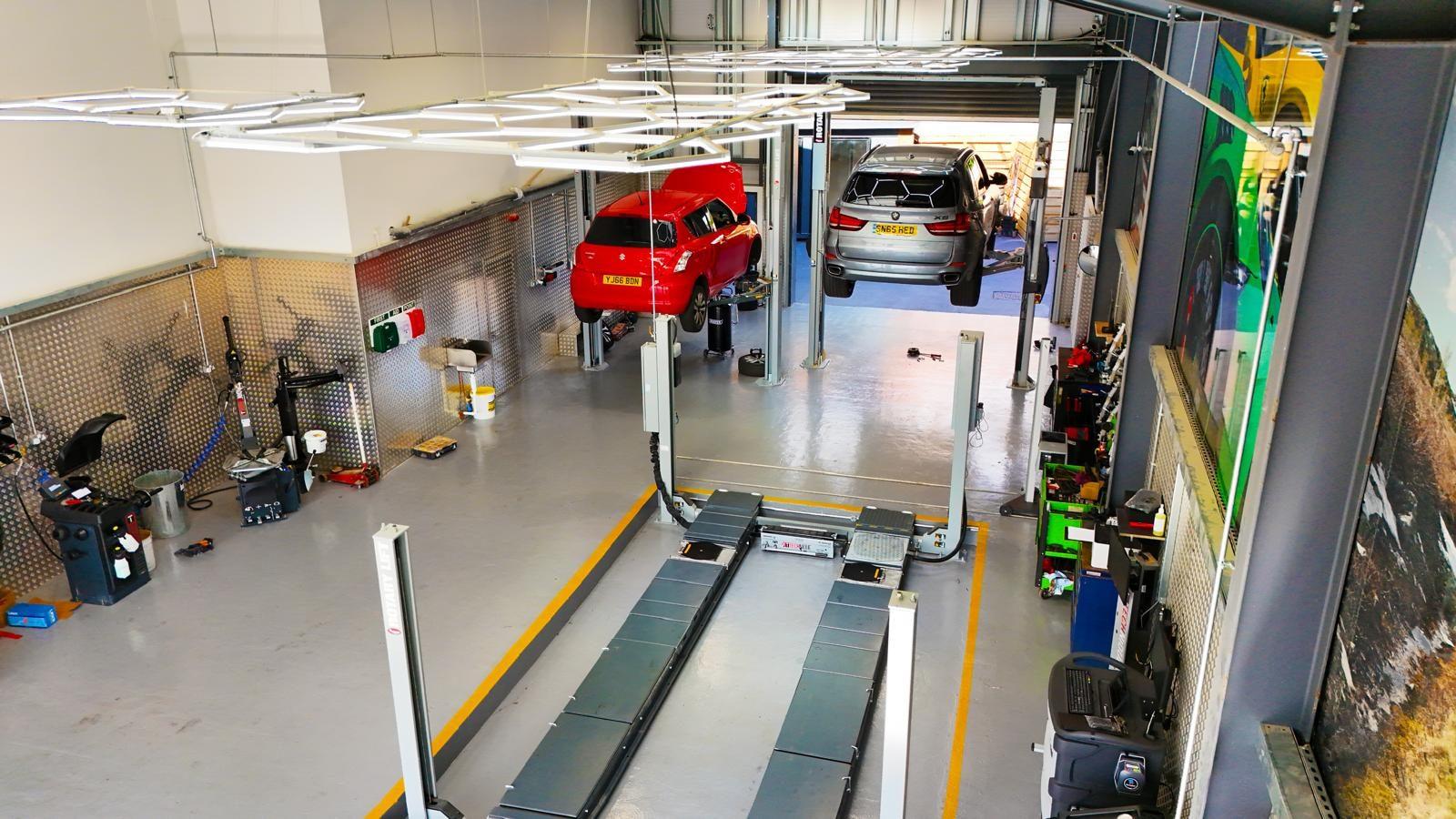 Cars on ramps in the Ignition Autocare workshop, Castleford