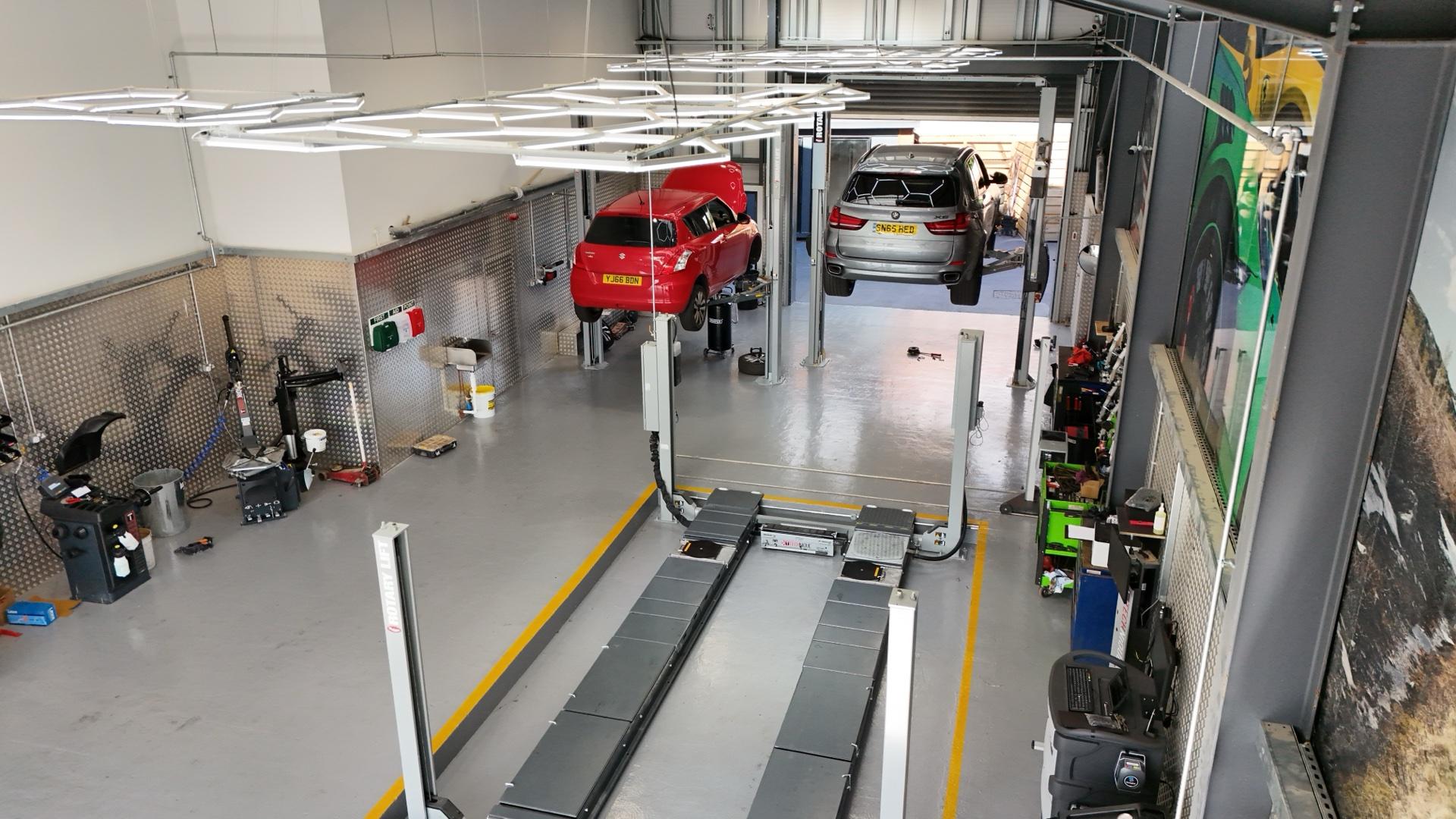 Car on the lift inside the Ignition Autocare workshop during a full service