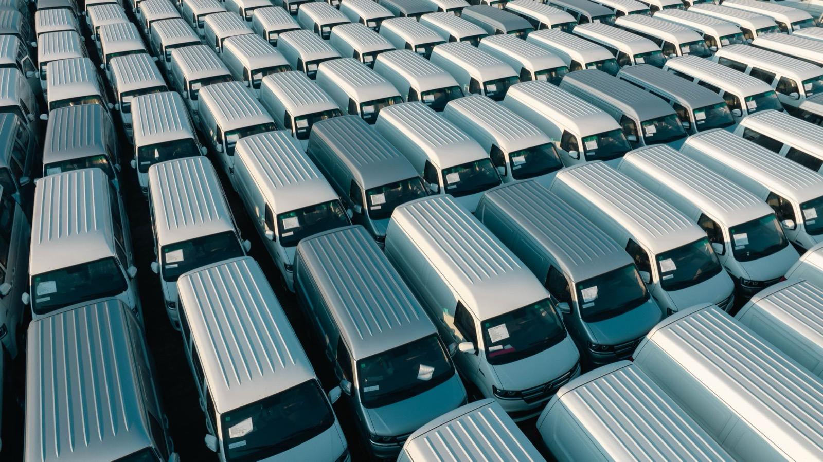 Rows of white commercial vans — fleet servicing and MOTs at Ignition Autocare